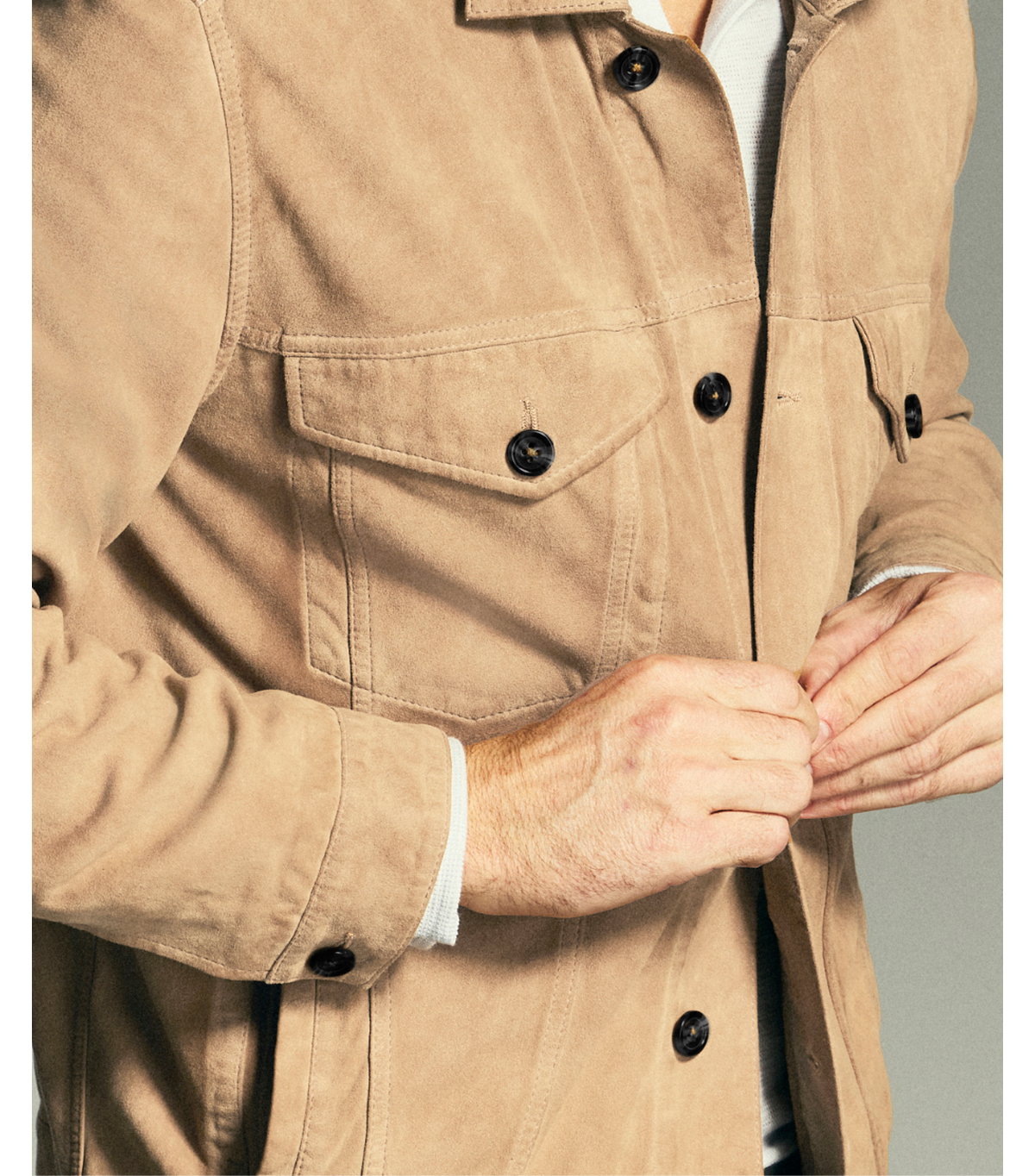 model buttons a tan suede jacket