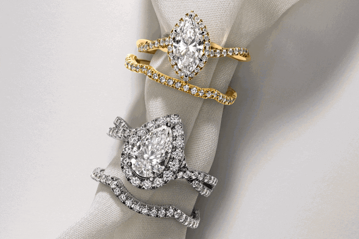 Marquise and pear-shaped diamond ring sets in yellow and white gold with matching pavé wedding bands. Stacking diamond bands.