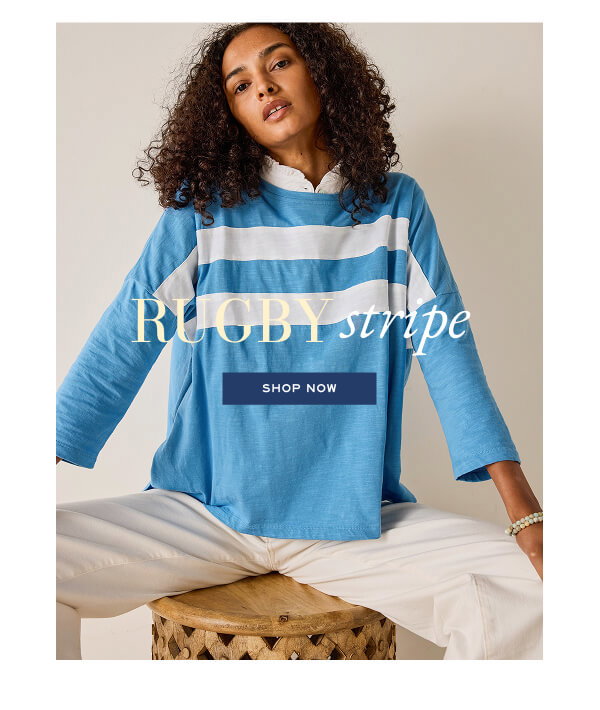 Rugby Stripe - Shop now -Image of a woman wearing a blue long sleeve tee with white stripes