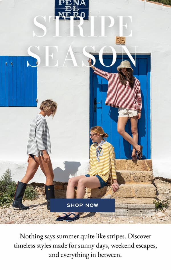Stripes Season - Shop now - Image of women in different color striped shirts outside a house.