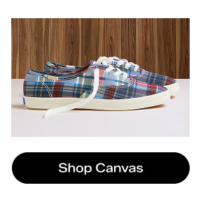 A side view of the Keds Champion Canvas Classic Plaid Lace-Ups in blue/red. Shop Canvas.