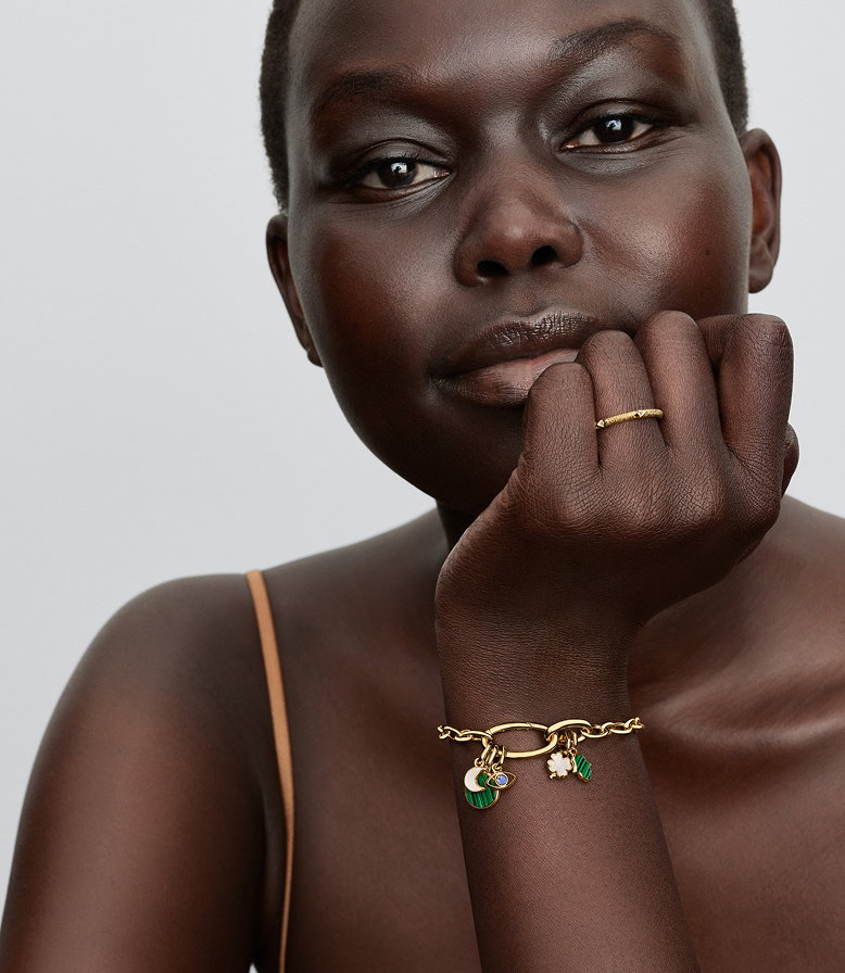 A model wears a sterling silver Pandora ME link chain bracelet and necklace with blue charms.