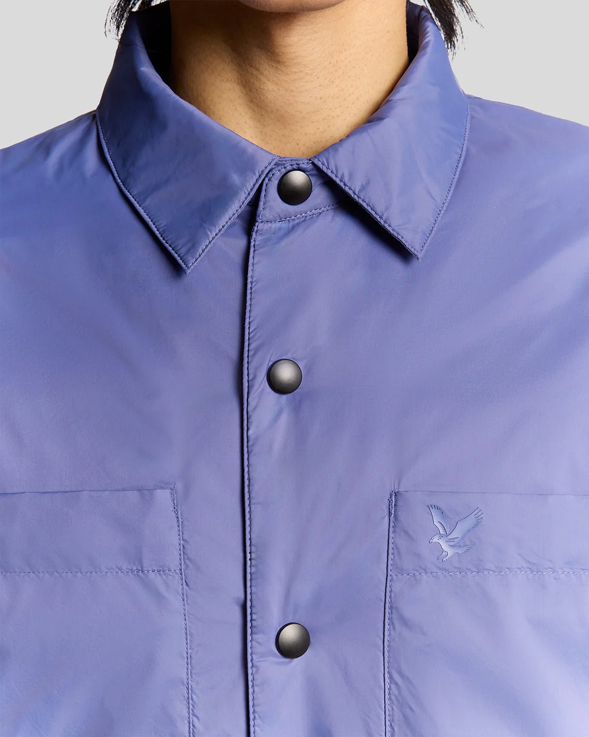 Man wears Water Resistant Insulated Overshirt in Twilight