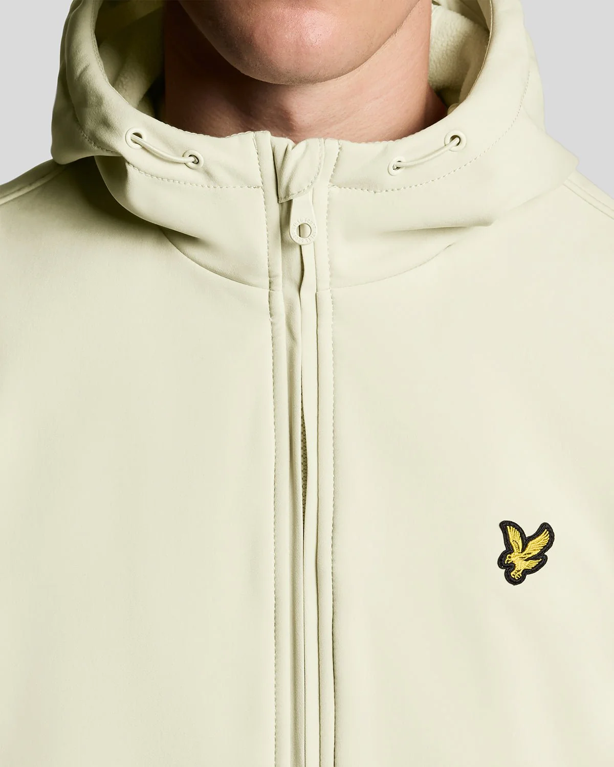 Man wears Fleece Lined Softshell Jacket in Grey Taupe