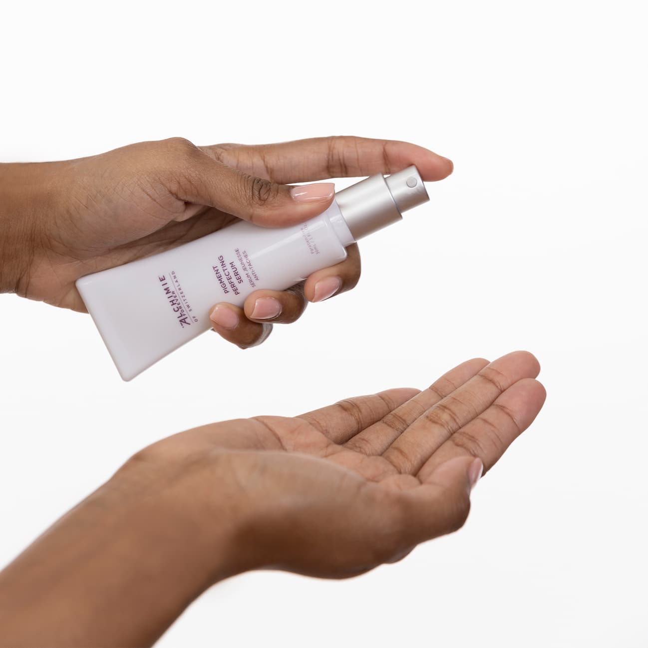 An image of two hands using Pigment Perfecting Serum.