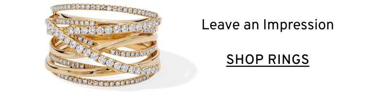 Stack of gold and diamond rings. Leave an impression. Click to Shop Rings