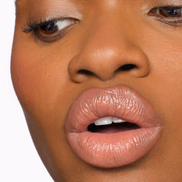 Model applying Futurelipstick Deluxe Shine