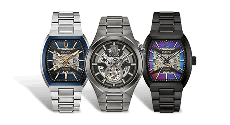 Three Bulova Maquina automatic watches featuring silver, black and blue designs with open-heart dials.