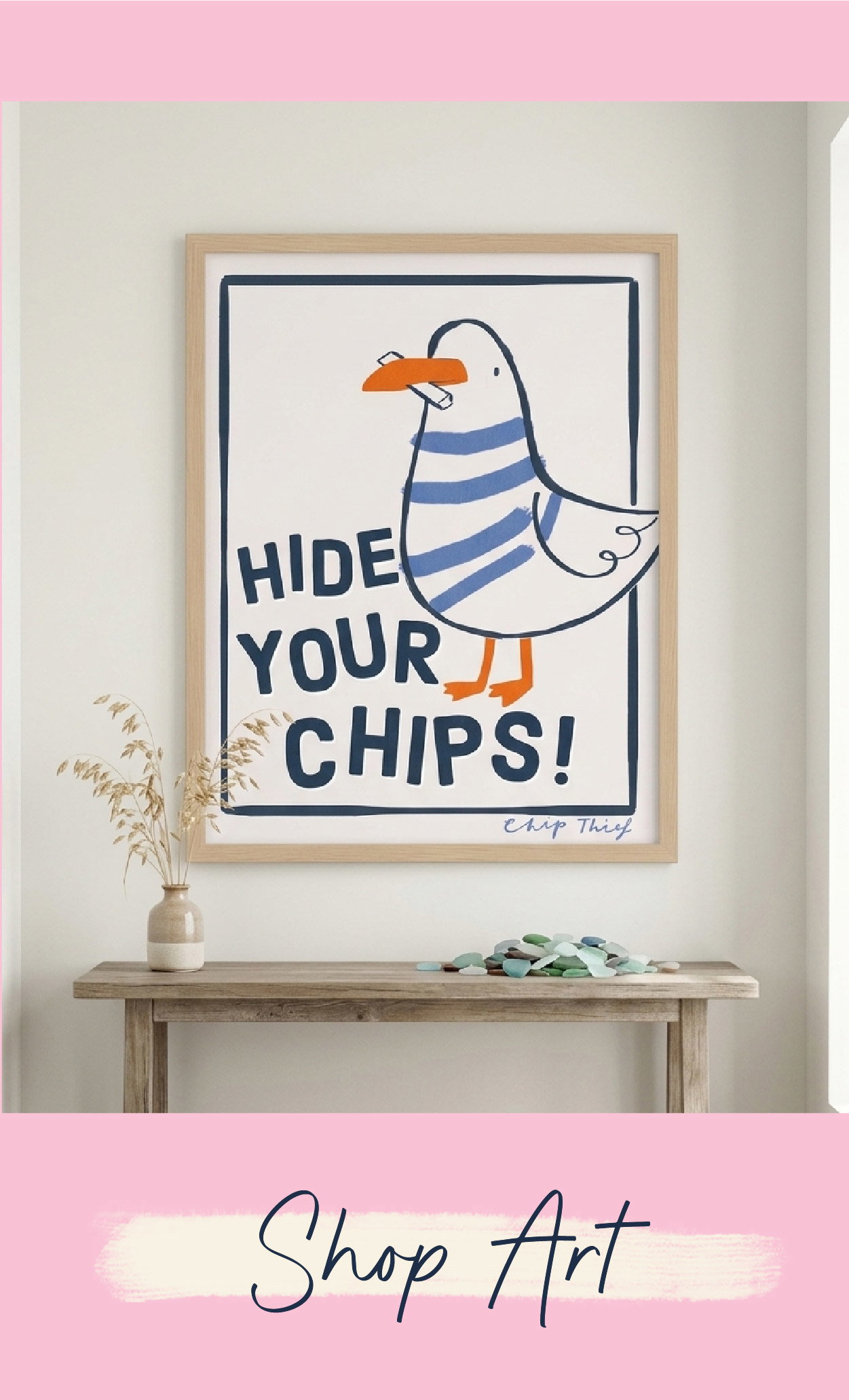 Framed seagull art print displayed in a bright home interior. Shop our art collection.