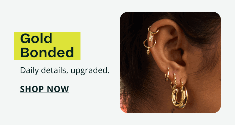 Gold ear stack with variety of hoops, huggies & dangling charms. Gold Bonded. Daily details. Click here to shop now