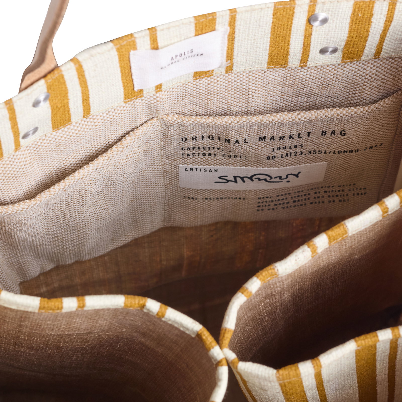 Interior of the gold stripe Apolis Wine Tote showing the printed label