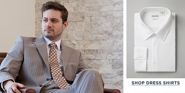 Man poses in a wrinkle free dress shirt and JM Haggar suit