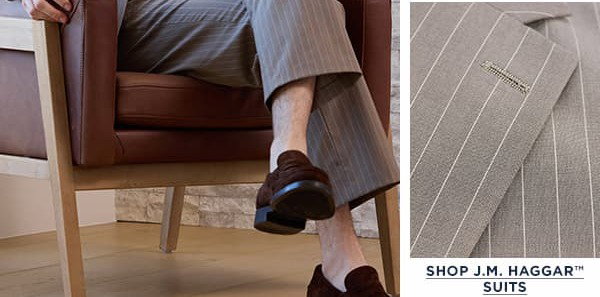 Man poses in a wrinkle free dress shirt and JM Haggar suit