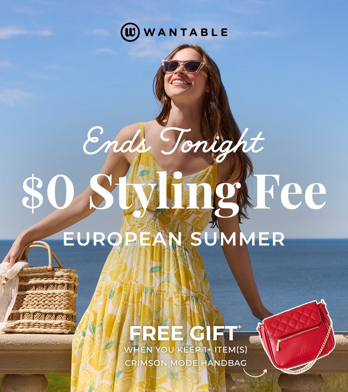 European Summer dresses and separates hang on a wooden rack beside bags and folded denim.
