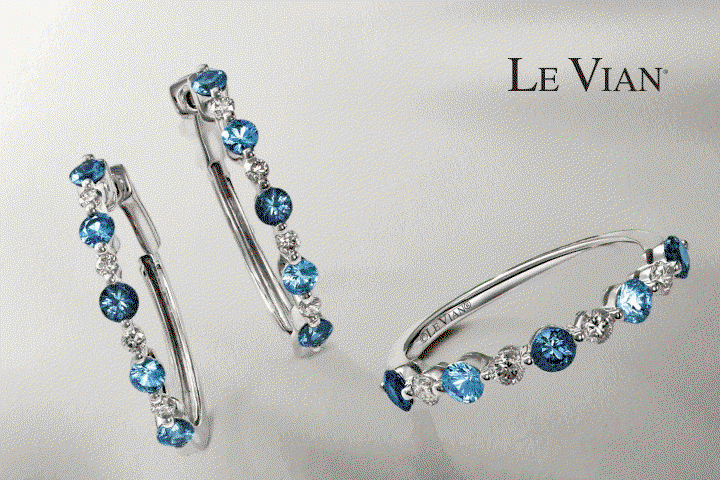 Le Vian blue gemstone earrings and matching ring. Bulova watch with mother-of-pearl dial. Name bracelet with blue gemstone.