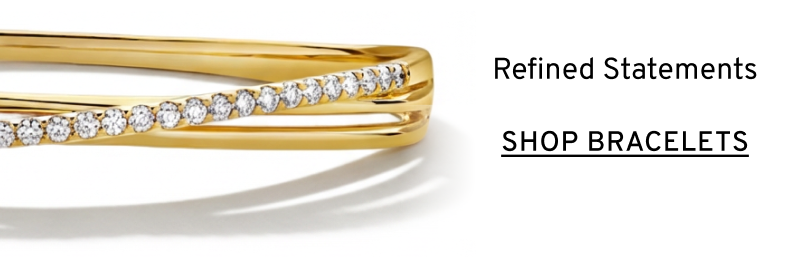 A yellow gold and diamond bangle. Refined statements. Click to Shop Bracelets