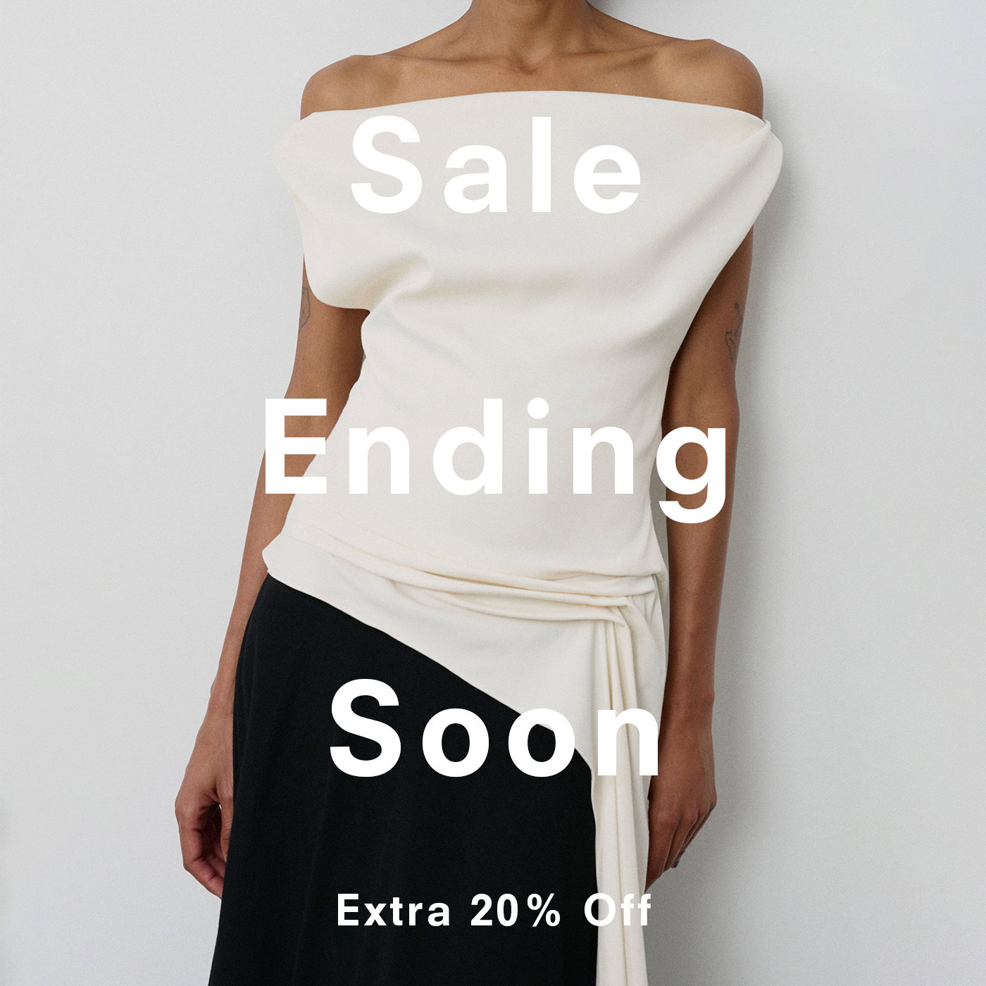 Cropped image of model wearing the Daliah Dress in Satin Back Crepe in Ecru Black with 'Sale Ending Soon' 'Extra 20% Off' laid over
