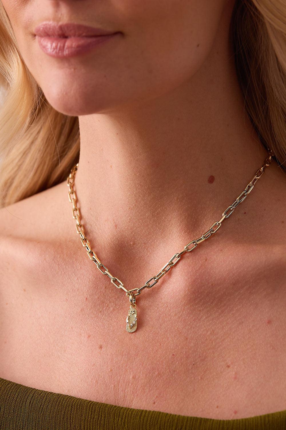 an image of a woman wearing a bracelet with pearls on it