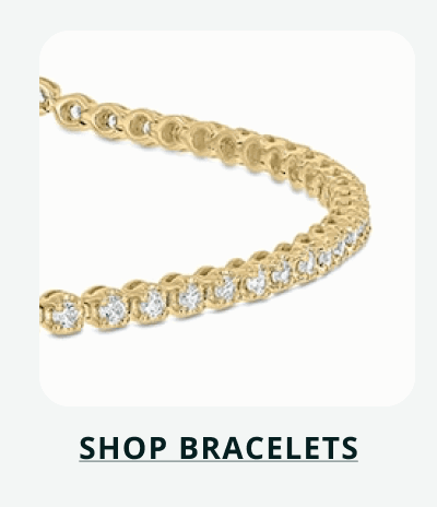 Gold band with five circle-cut diamonds on centre. Click here to shop rings