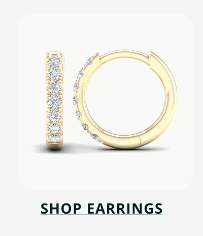 Gold-set mini hoops with diamond details on exterior. Click here to shop earrings