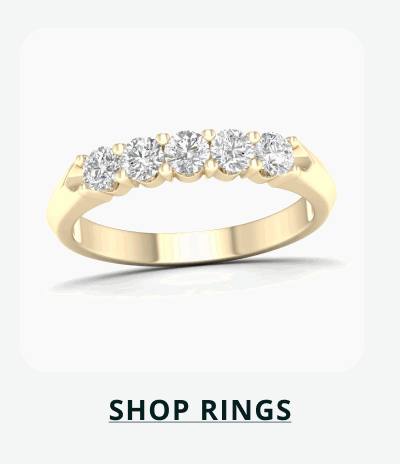 Gold band with five circle-cut diamonds on centre. Click here to shop rings