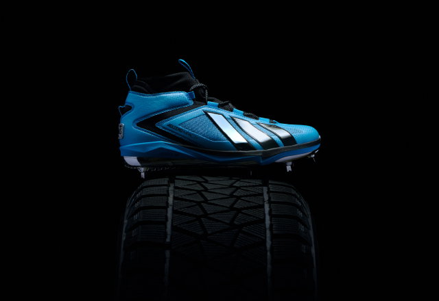 ADIZERO racing cleat on tire 