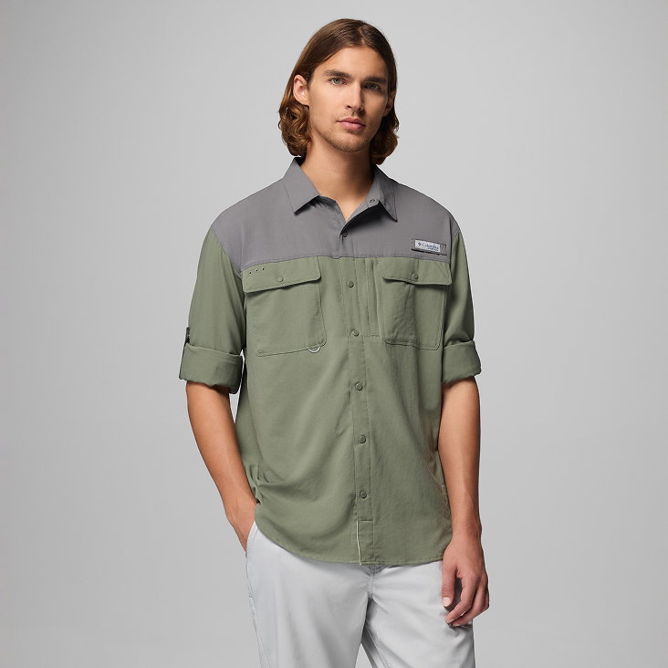 A man wearing a green long sleeve button-up shirt.
