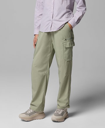 Waist-down image of a woman wearing green cargo pants.