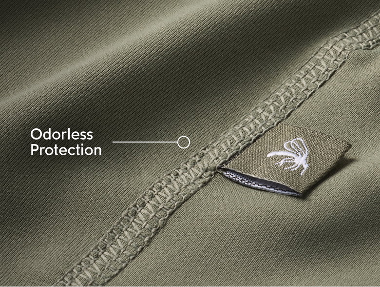 Close-up of green fabric with text: Odorless Protection