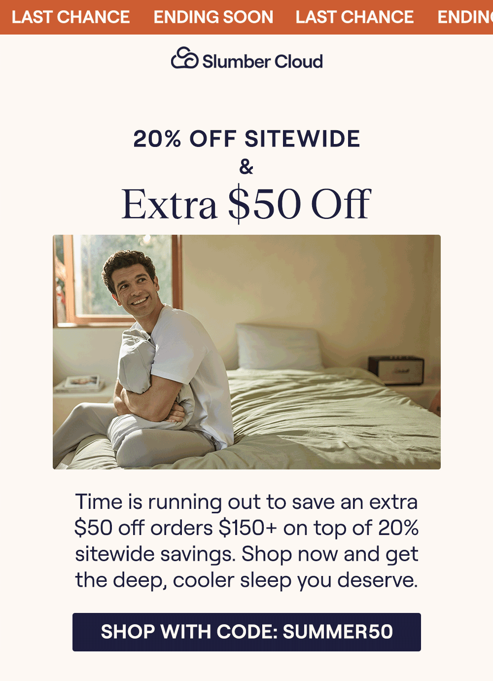 Man sitting on a bed hugging a pillow
