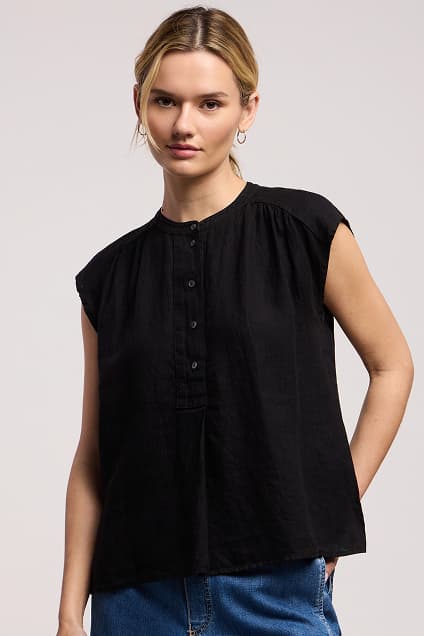 Image shows a model wearing the Bec Linen Top in Black.