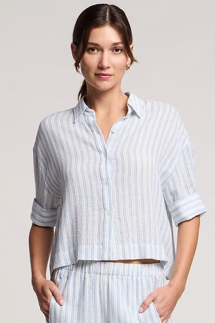 Image shows a model wearing the Greya Shirt in White and Blue.