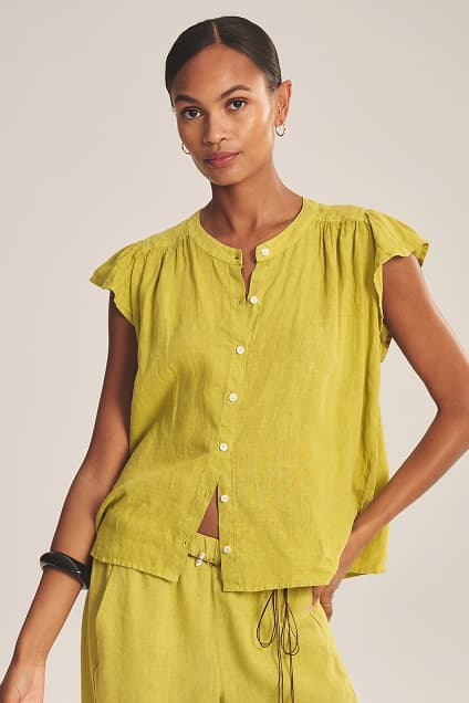 Image shows a model wearing the Janey Top in Citron.