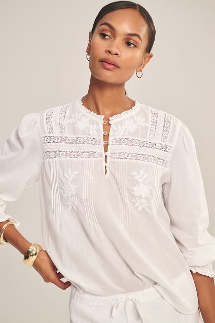 Image shows a model wearing the Byrdie Top in White.