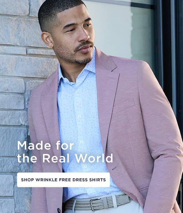 Man poses in a wrinkle free dress shirt, headline reads, "Made for the Real World"