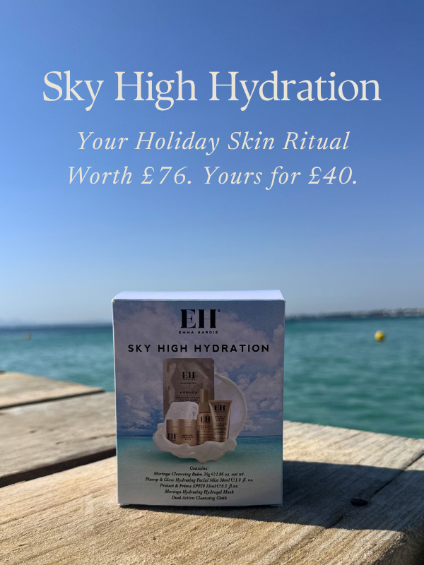 Emma Hardie Sky High Hydration travel skincare set beside the sea.