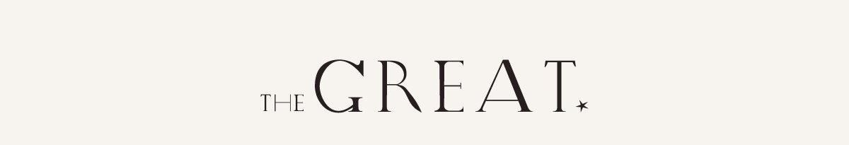 The words "THE GREAT" displayed in elegant black serif typography on an off-white background, with "THE" in smaller uppercase letters positioned to the left of the larger word "GREAT," followed by a small star symbol.