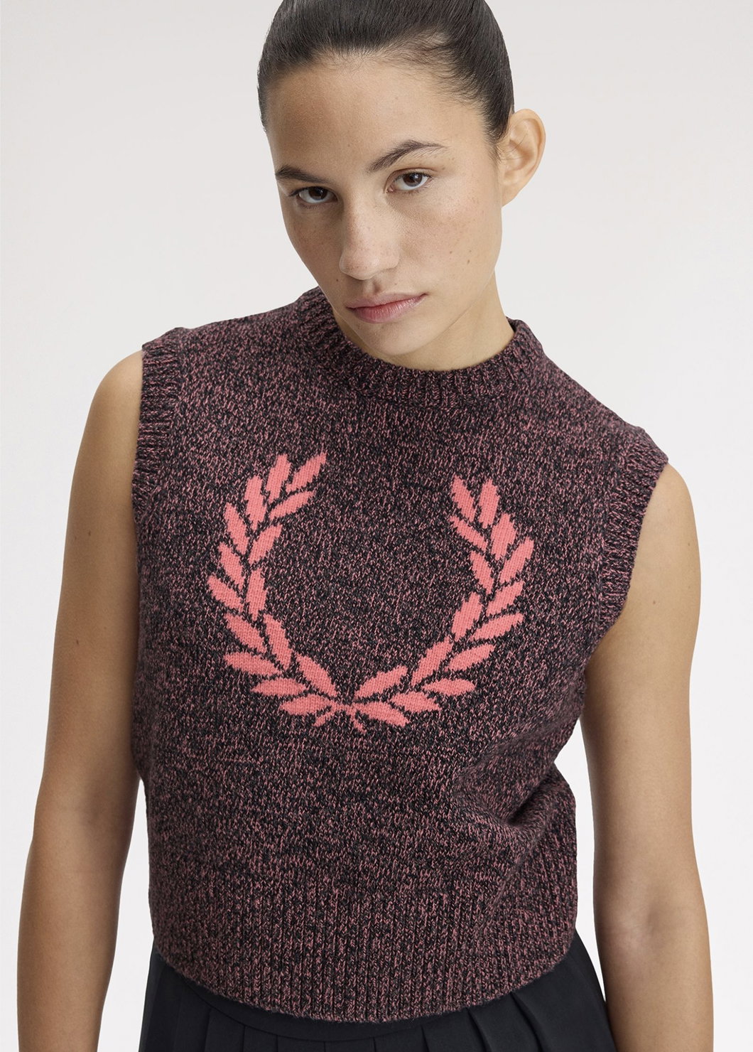 Female model wearing a Fred Perry Twisted Marl Knitted Tank in Flamingo Tan