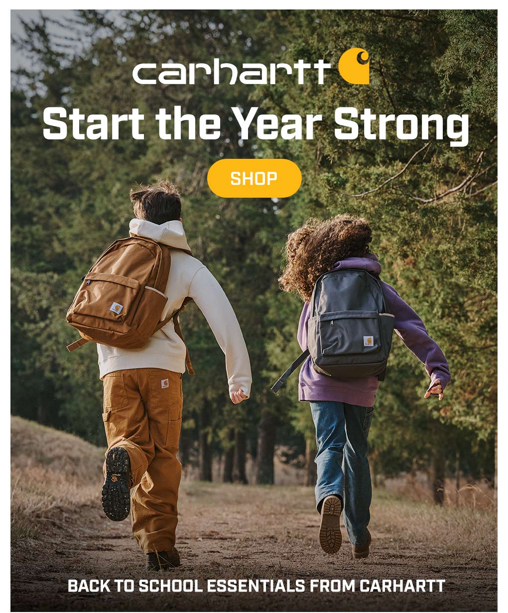 Two children running with backpacks