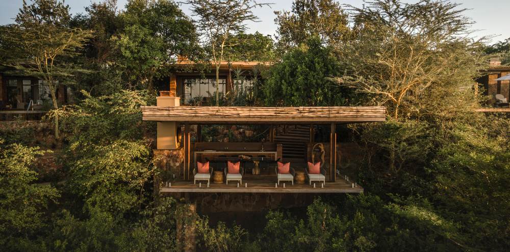 Open-air dining deck at Singita Kilima