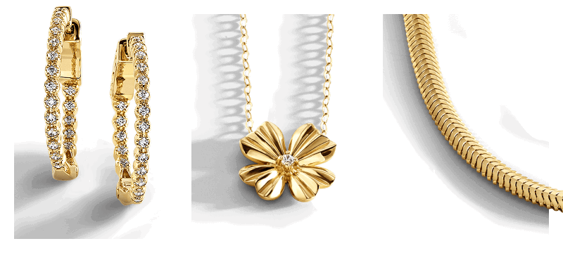 Yellow gold diamond hoop earrings, flower pendant necklace with diamond center on dainty chain and herringbone chain necklace.