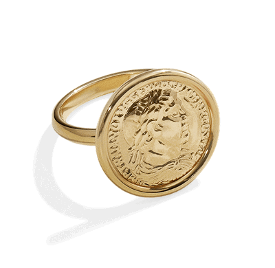 Yellow gold signet ring featuring a round engraved coin-inspired design.