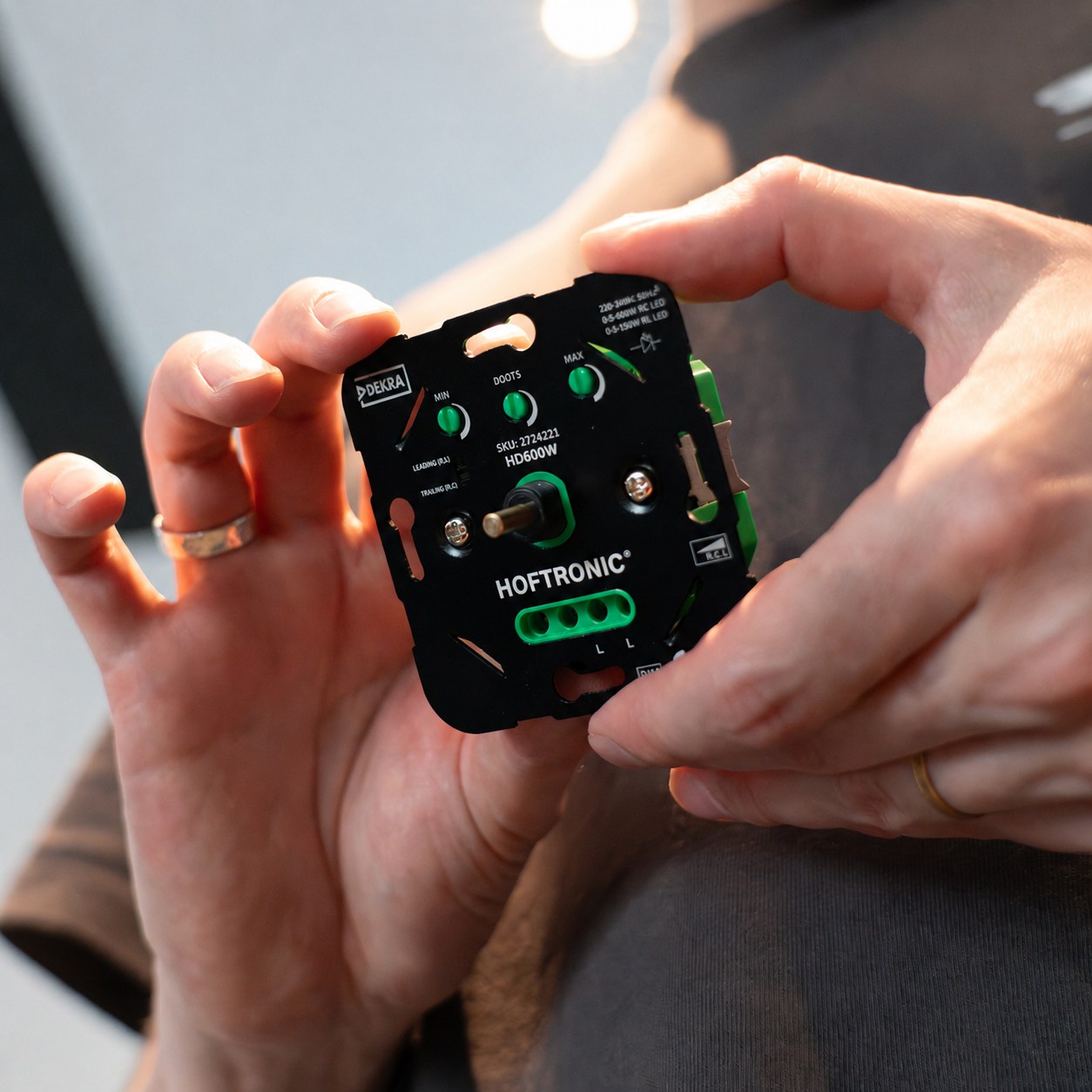 Photo of the HD200 LED dimmer, showing the dimmer being held in the hand