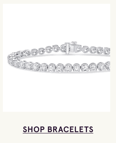 Silver tennis bracelet with continuous line of round-cut diamonds. Click here to shop bracelets