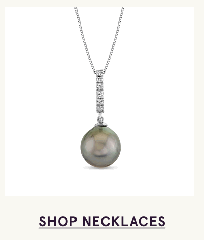 Silver pendant with iridescent Tahitian pearl with vertical bar of diamonds. Click here to shop necklaces