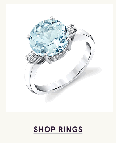 Silver ring with large, round light blue aquamarine centre stone. Click here to shop rings