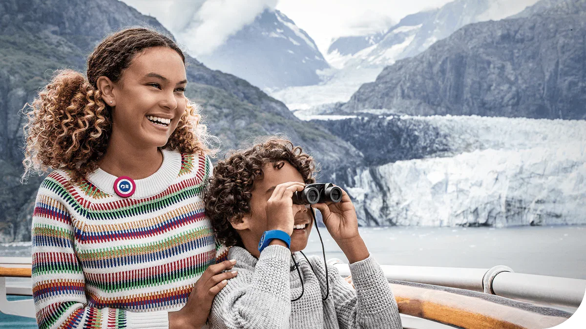 Two children enjoy viewing glaciers at Glacier Bay National Park, Alaska