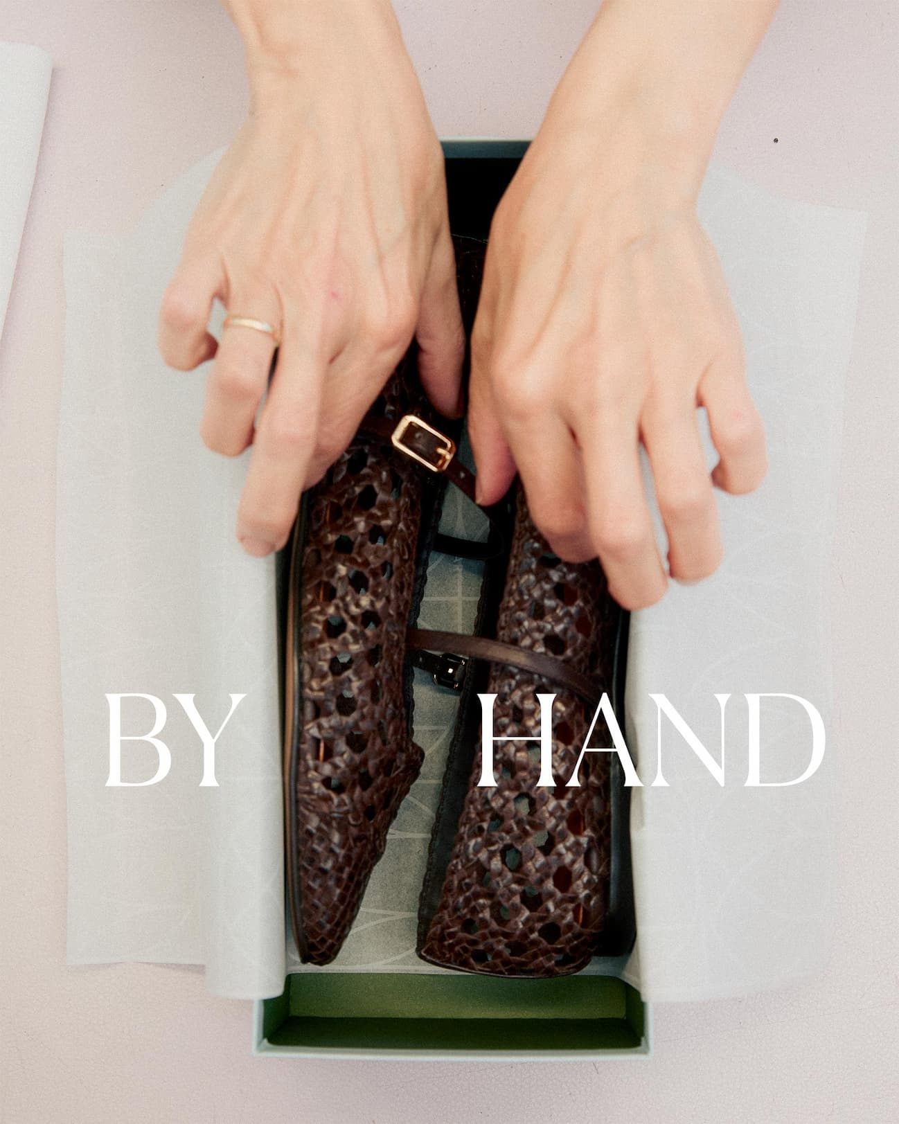 By hand