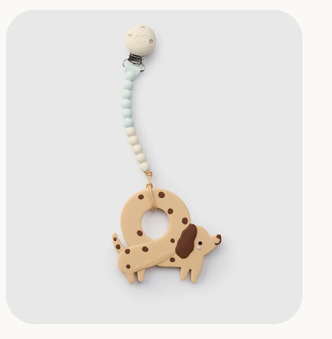 pretzel dog teether on a blue and yellow silicone pacifier clip