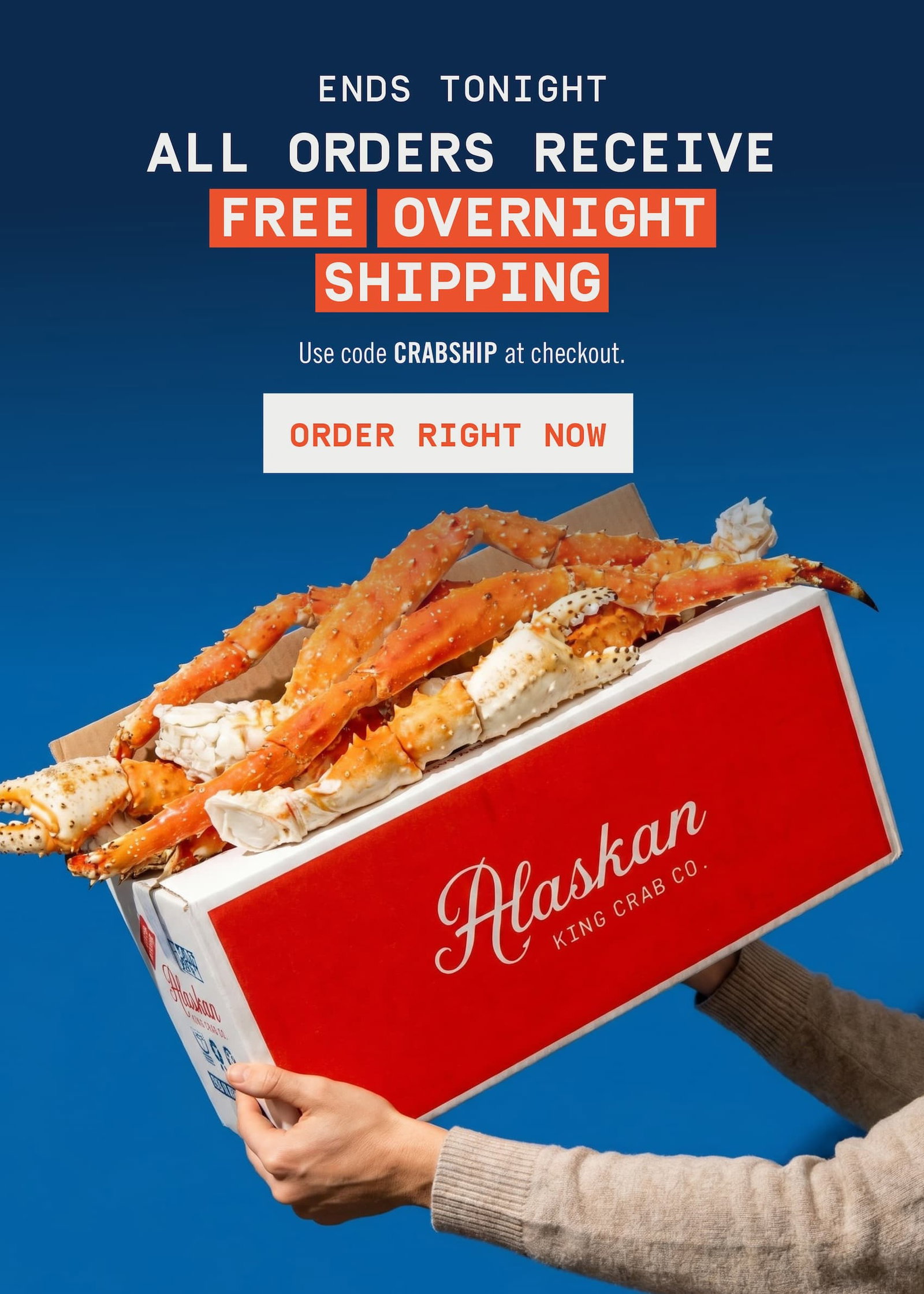 Hands holding box with King Crab Legs